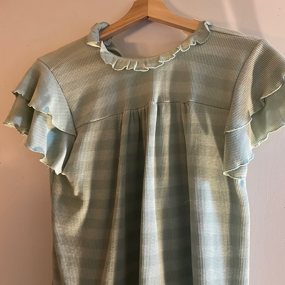 Perfect peach brand striped flutter sleeve shirt with ruffle neck.
